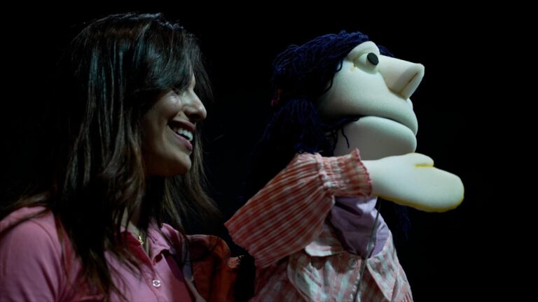 A facilitator performing with a puppet